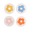 Four round coasters with colorful flower designs on a white background