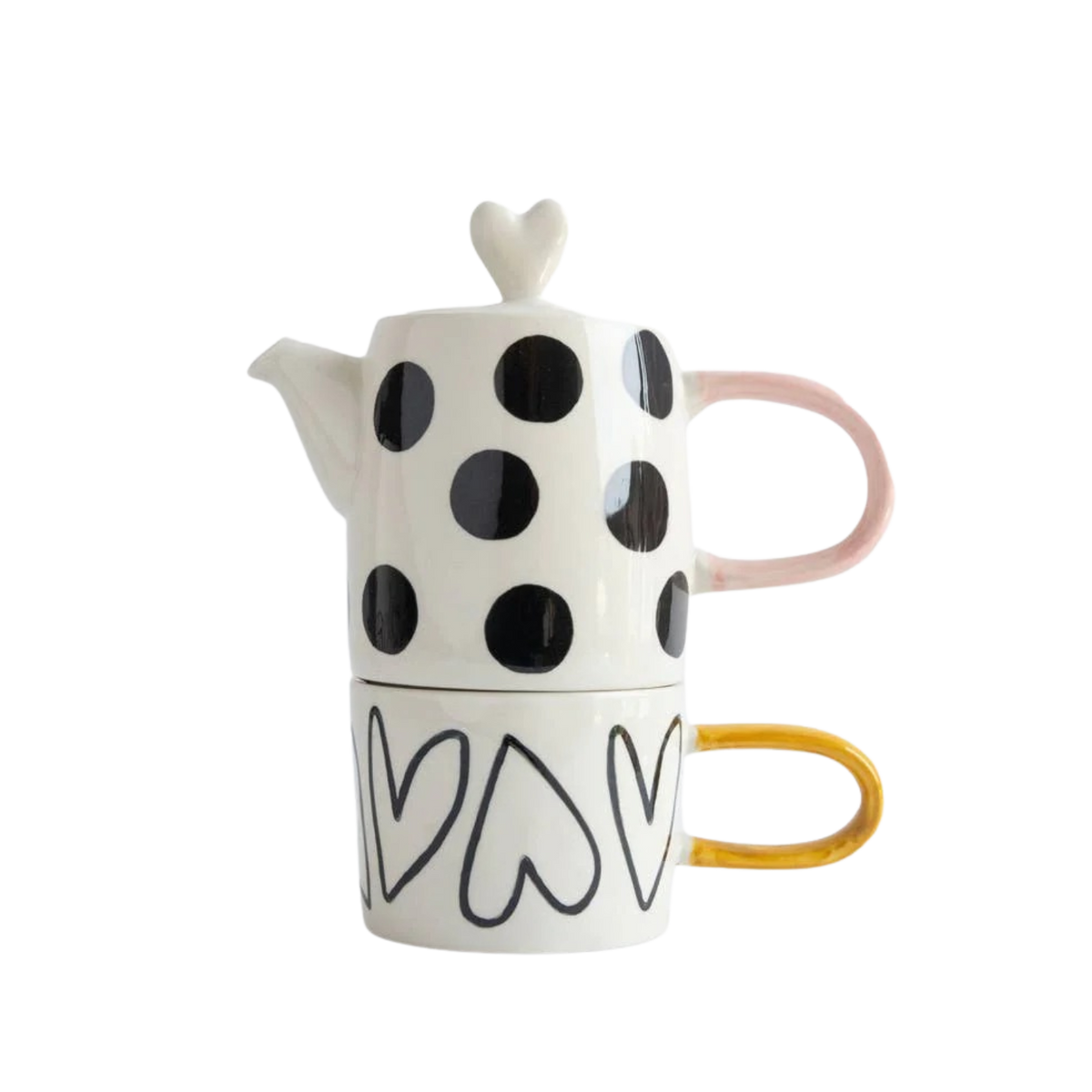 Ceramic teapot and mug set with black polka dots and heart designs on a white background