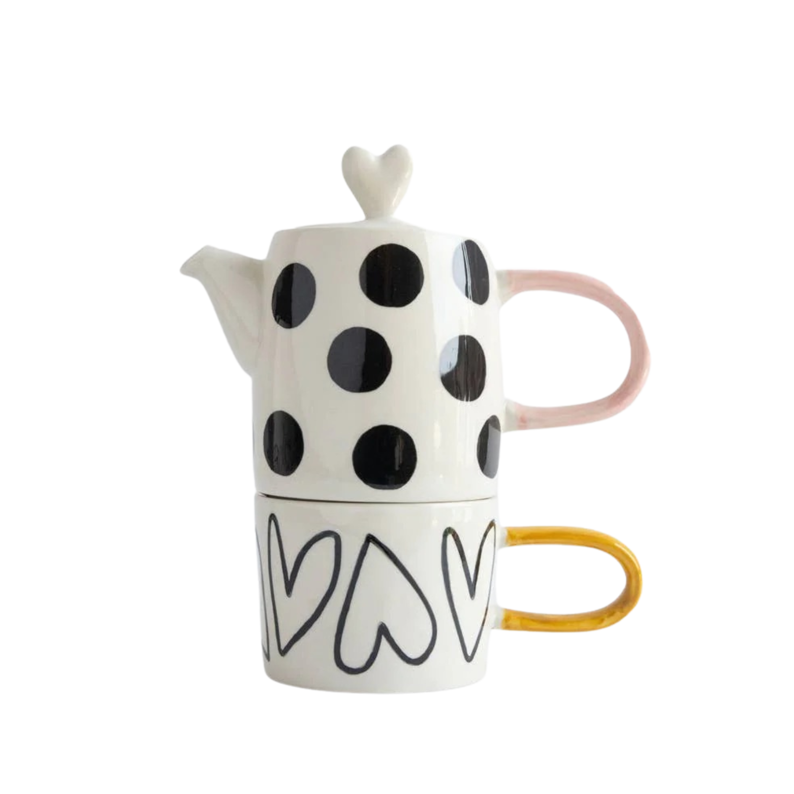 Ceramic teapot and mug set with black polka dots and heart designs on a white background