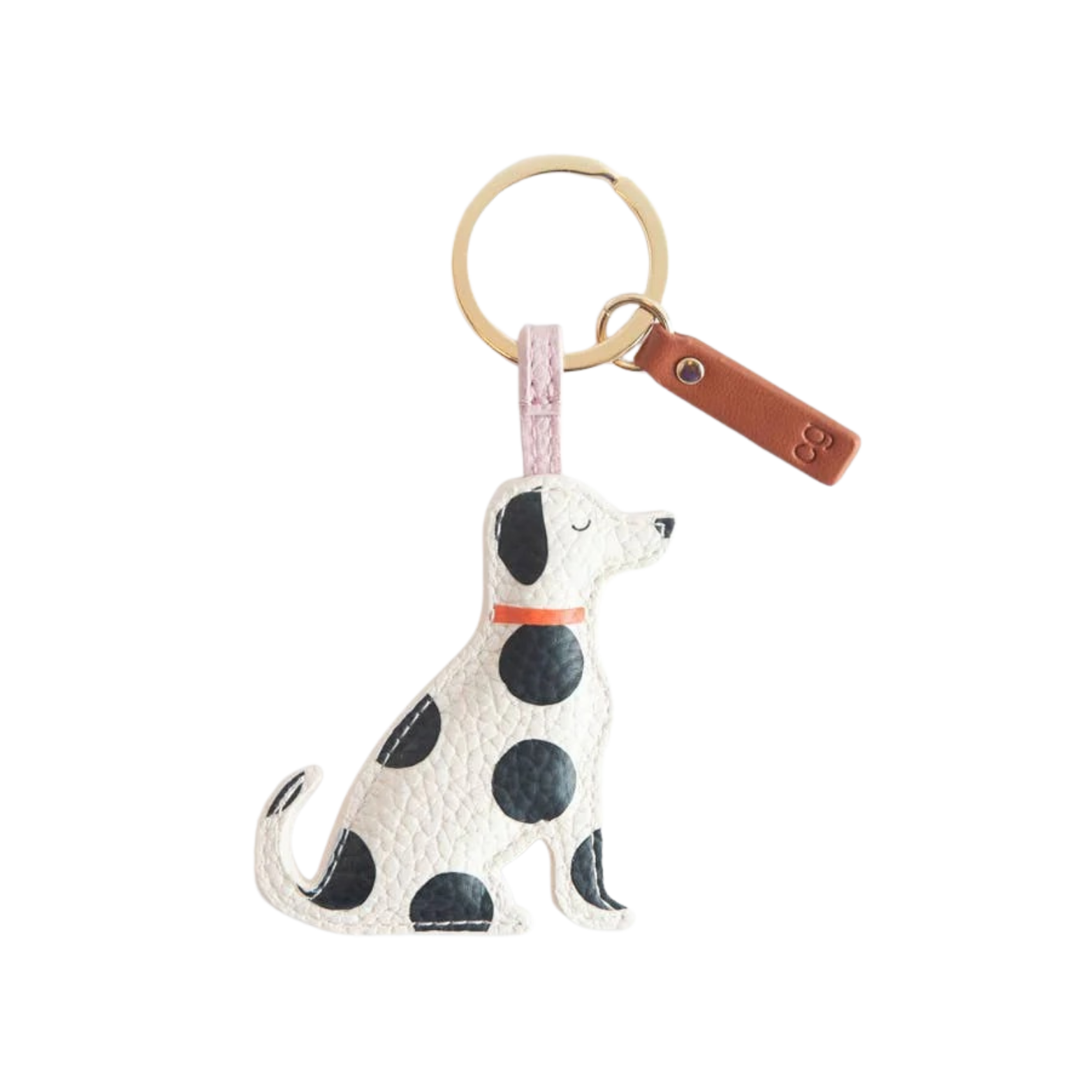 Dog-shaped keychain with polka dot pattern on a white background