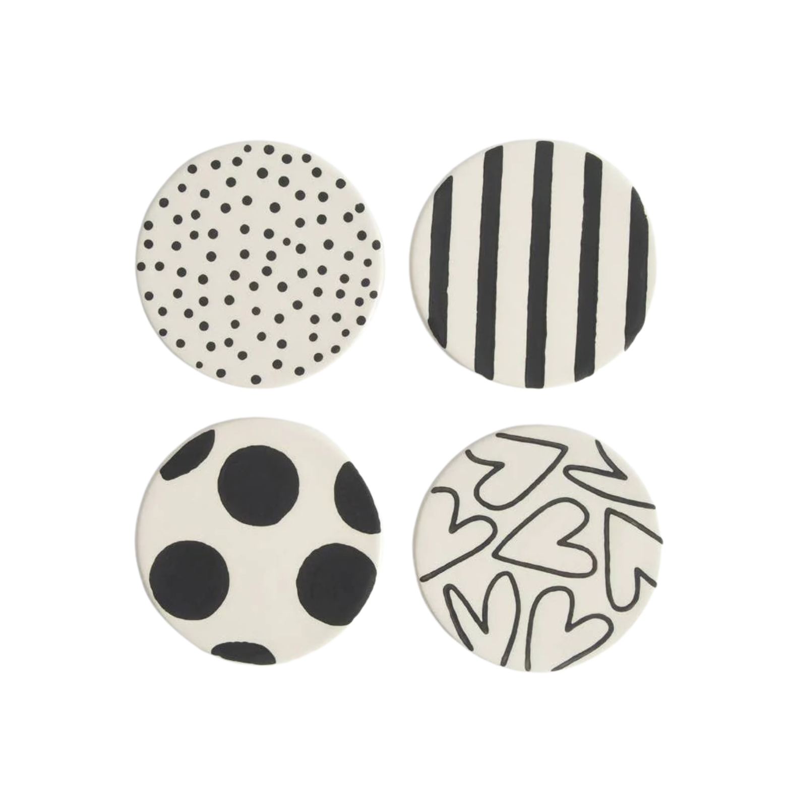 Four round coasters with black and white patterns on a white background