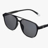 Black sunglasses with dark lenses on a white background