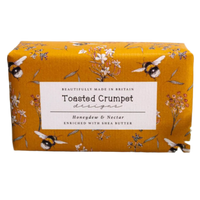 Bar of soap with 'Toasted Crumpet' packaging featuring floral and bee design on a white background.