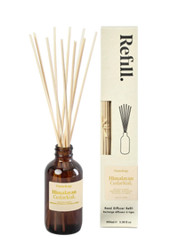Himalayan Cedarwood reed diffuser bottle with packaging on a white background