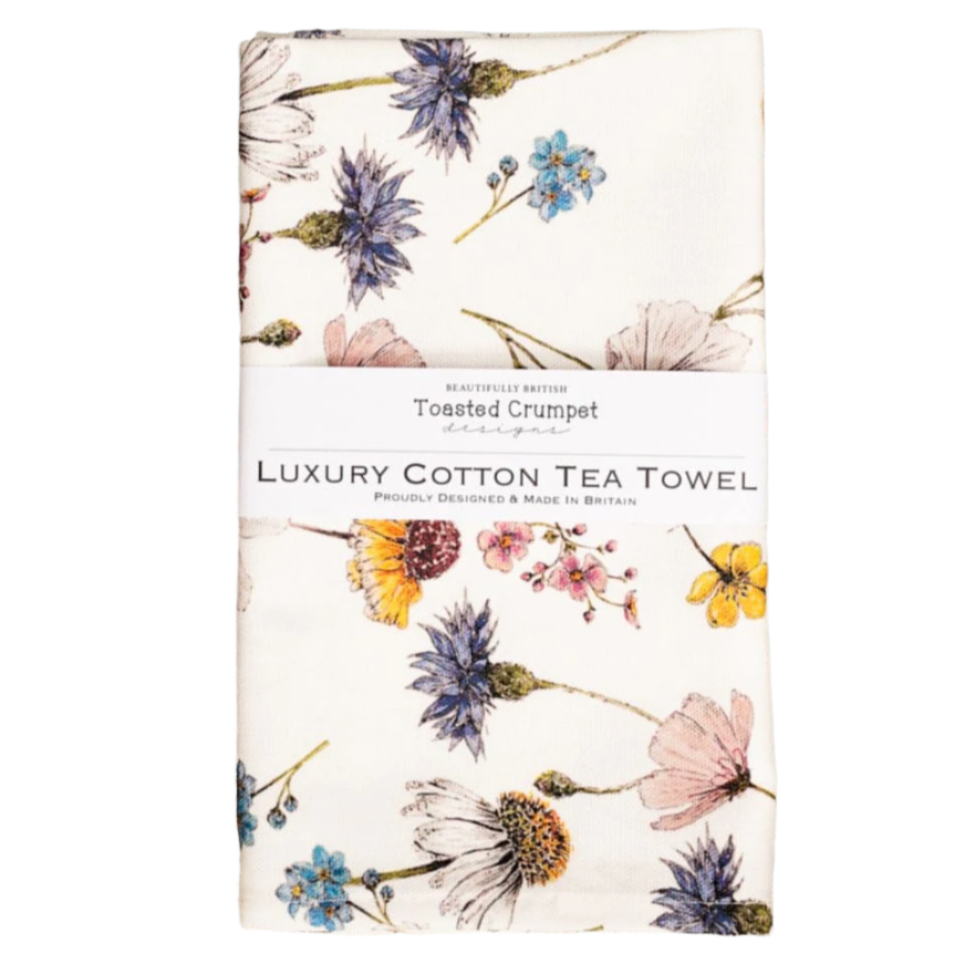 Floral patterned tea towel on a white background