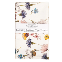 Floral patterned tea towel on a white background