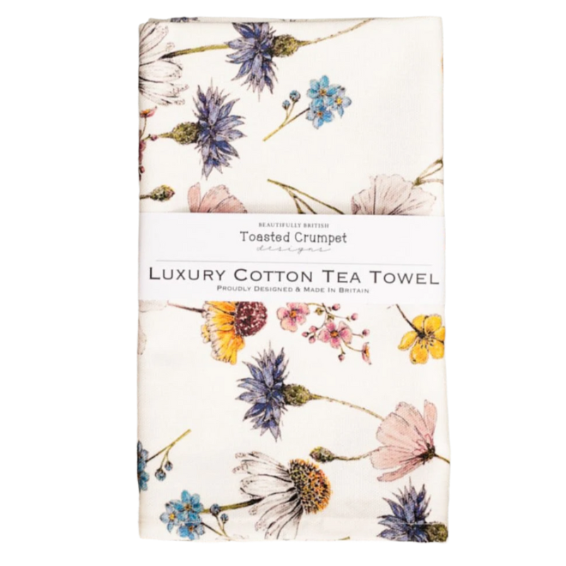 Floral patterned tea towel on a white background