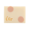 Bar of Oir Rose Geranium soap from the front on a white background. Beige bar, pink dot pattern and gold Oir logo.