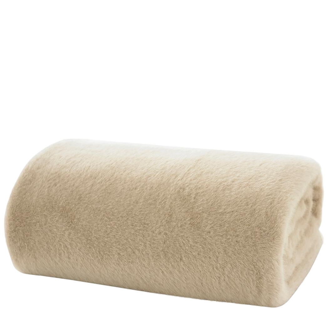 Rolled beige throw on a white background