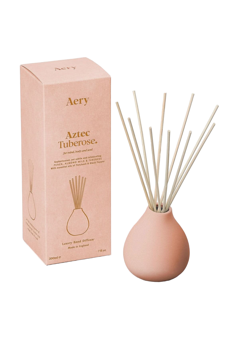 Aery Aztec Tuberose diffuser with packaging on a white background