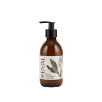 Brown bottle of St. Eval Bay & Rosemary hand lotion on a light beige background