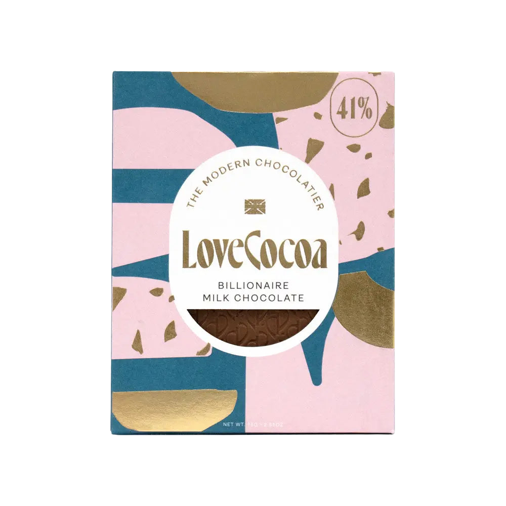 A bar of Love Cocoa Billionaire Milk Chocolate with 41% cocoa displayed in a pink and gold packaging with terrazzo pattern and brand logo.