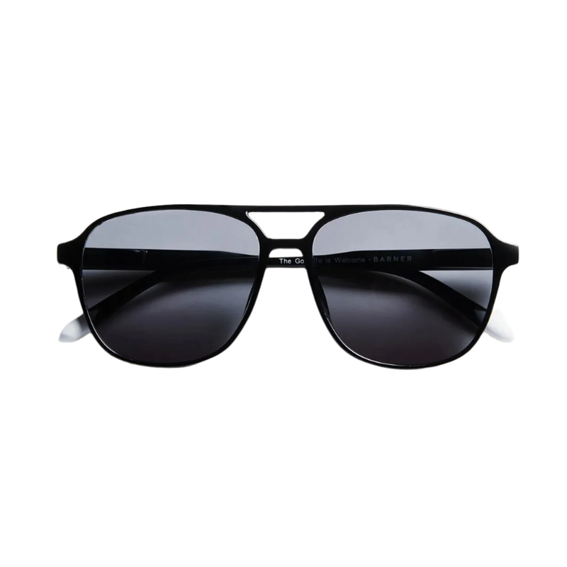 Black sunglasses with dark lenses on a white background