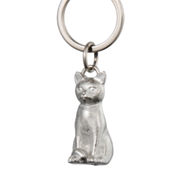 Silver cat-shaped keychain on a white background