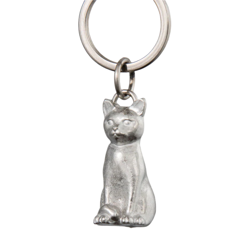 Silver cat-shaped keychain on a white background