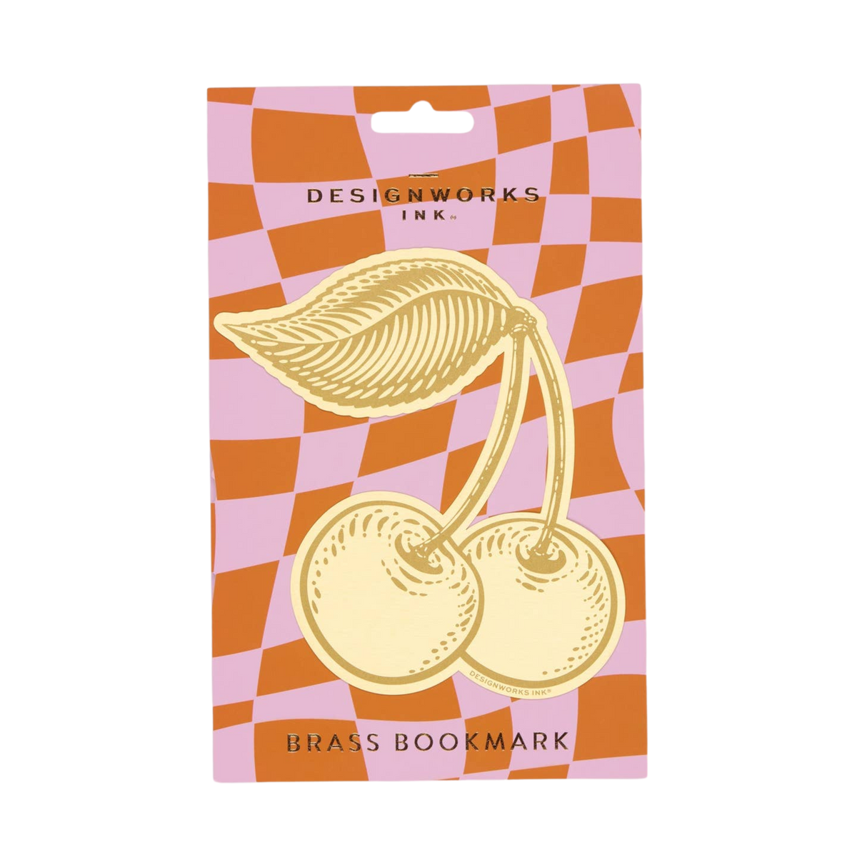 Packaged brass bookmark with cherry design on a checkered background