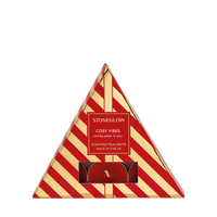 Triangular packaging of Stoneglow Cosy Vibes scented tea lights with red and gold design.