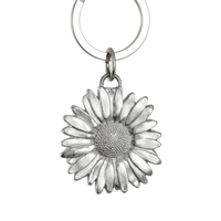 Silver daisy flower keychain on a white background