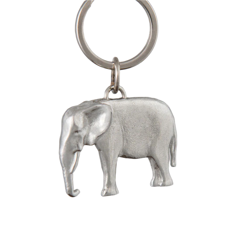 Silver elephant keychain on a gray background