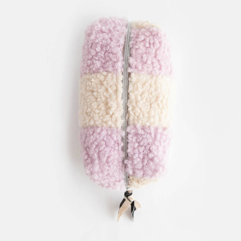 Pastel-colored fluffy pouch with a zipper on a white background