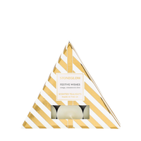 Triangular gift box with gold and white stripes containing a candle, branded 'Stoneglow'.