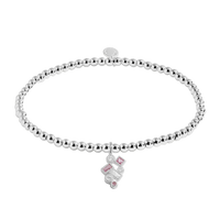 Silver bracelet with a pink heart charm on a white background