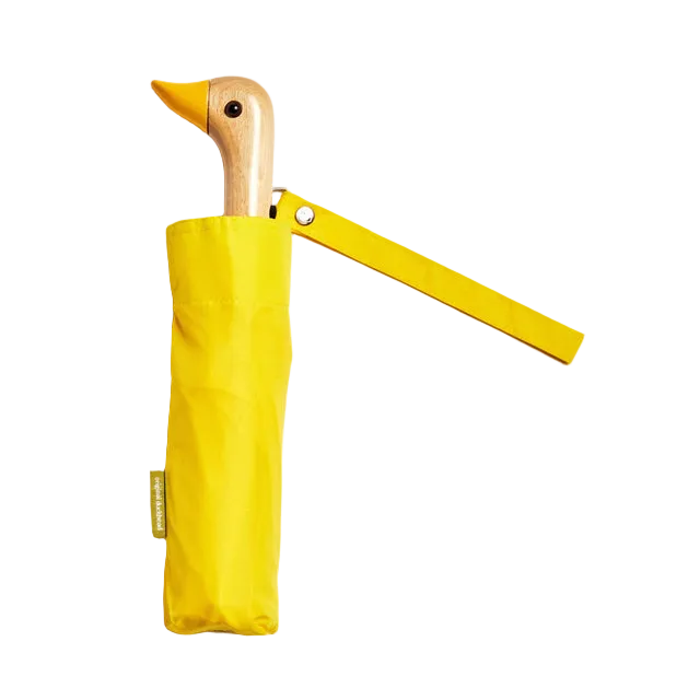 Yellow duck-shaped umbrella on a white background