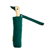 Green umbrella with duck-shaped handle on a white background