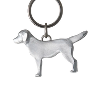 Dog-shaped keychain on a gray background