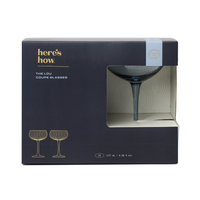 Boxed set of 'The Lou Coupe Glasses' by 'here's how' on a white background