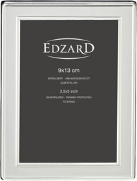 Silver picture frame with 'Edzard' branding and size specifications on a black background