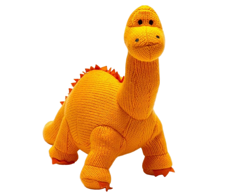 Knitted dinosaur toy in orange on a white background