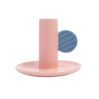 Pink and blue ceramic candlestick holder on a white background
