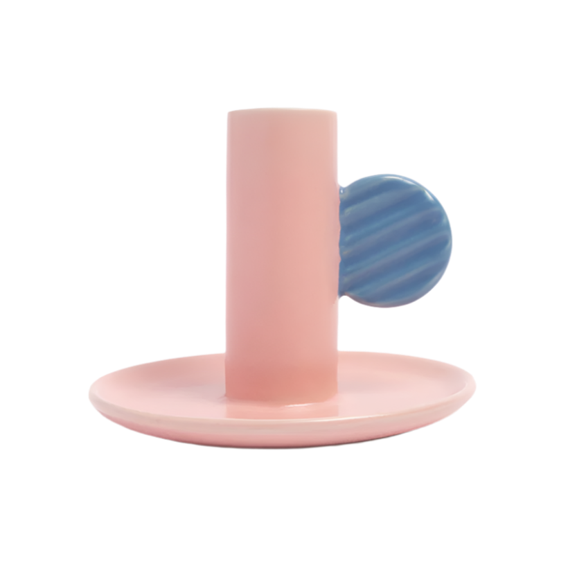 Pink and blue ceramic candlestick holder on a white background