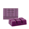 Purple wax melt bar with packaging labeled 'Stoneglow Spiced Rum & Fig' on a white background