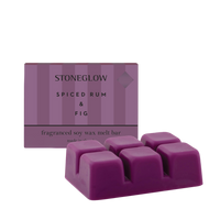 Purple wax melt bar with packaging labeled 'Stoneglow Spiced Rum & Fig' on a white background