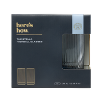 Box of The Stella Highball Glasses by 'here's how.' with blue tinted glasses inside.