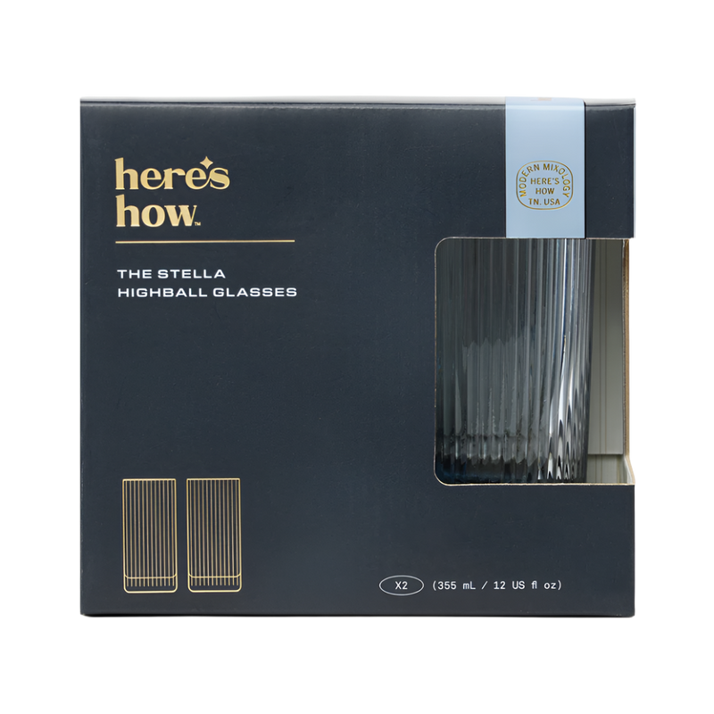 Box of The Stella Highball Glasses by 'here's how.' with blue tinted glasses inside.