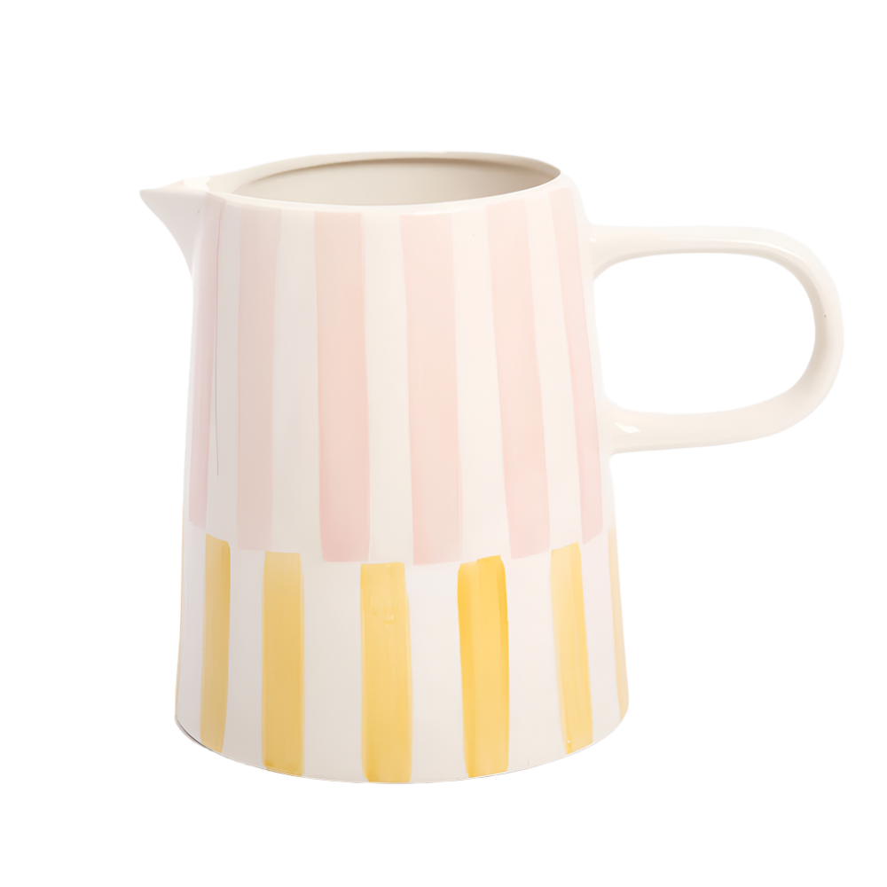 Ceramic pitcher with pink and yellow stripes on a white background