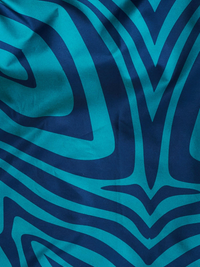 Close-up of fabric with blue and teal abstract pattern