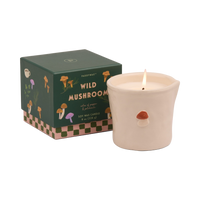 Candle with 'Wild Mushroom' packaging on a white background