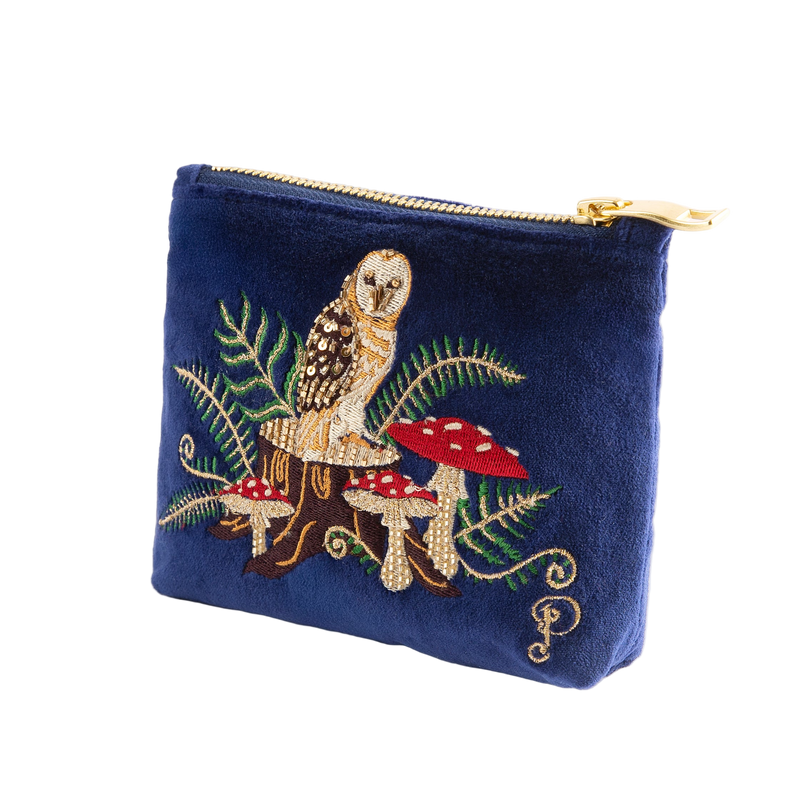 Navy blue pouch with owl and mushroom design on a white background