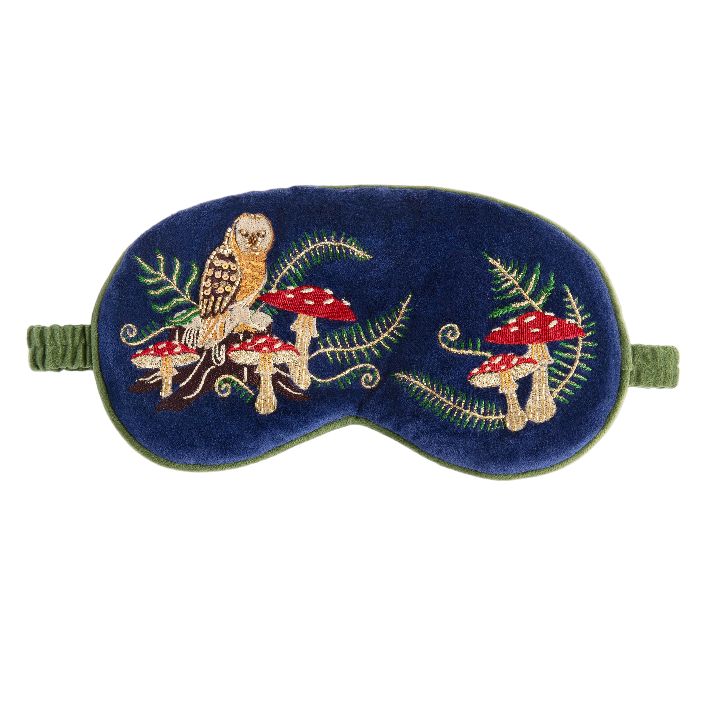 Embroidered eye mask with owl and mushroom design on a blue background